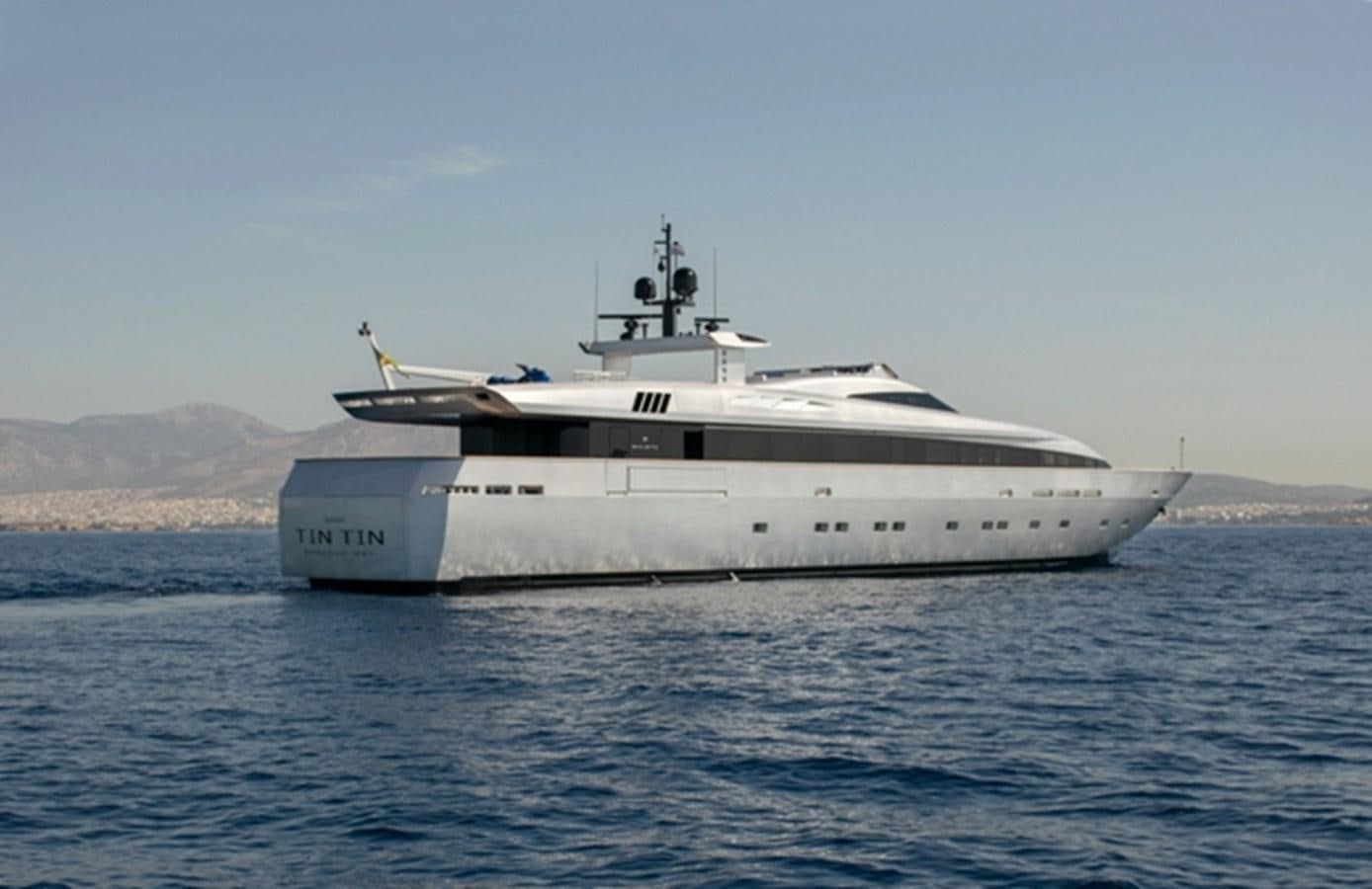 a large white ship in the water aboard TIN TIN Yacht for Sale