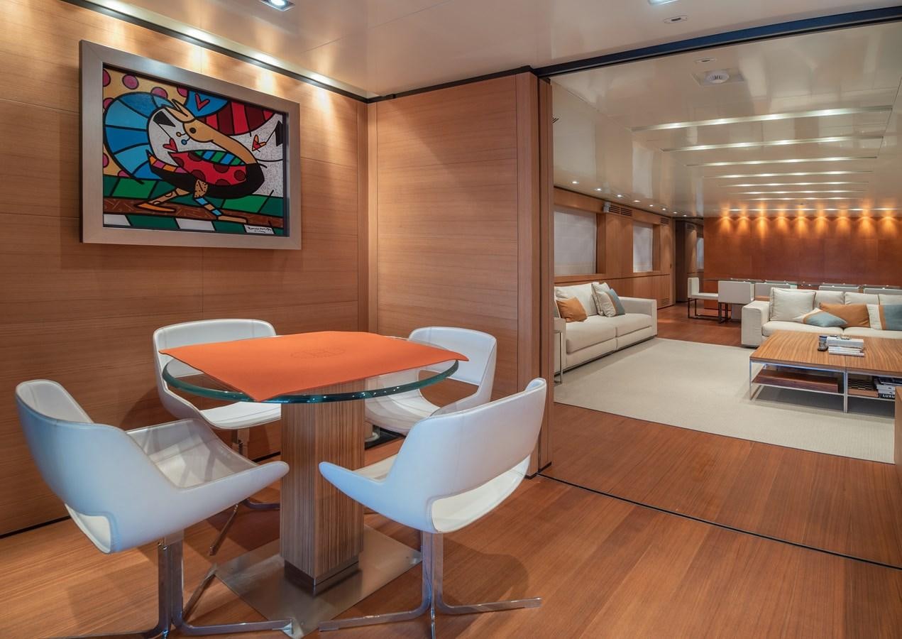 a room with a table and chairs aboard TIN TIN Yacht for Sale