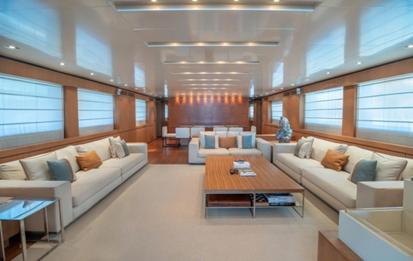 a living room with a couch and a coffee table aboard TIN TIN Yacht for Sale