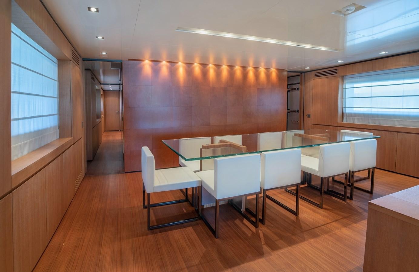 a room with tables and chairs aboard TIN TIN Yacht for Sale