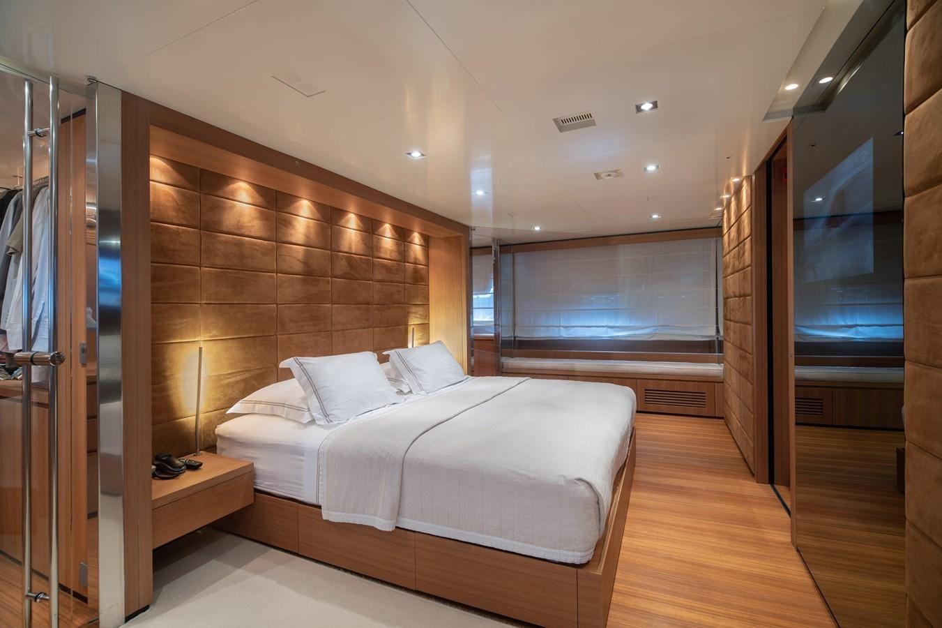 a room with a bed and a window aboard TIN TIN Yacht for Sale