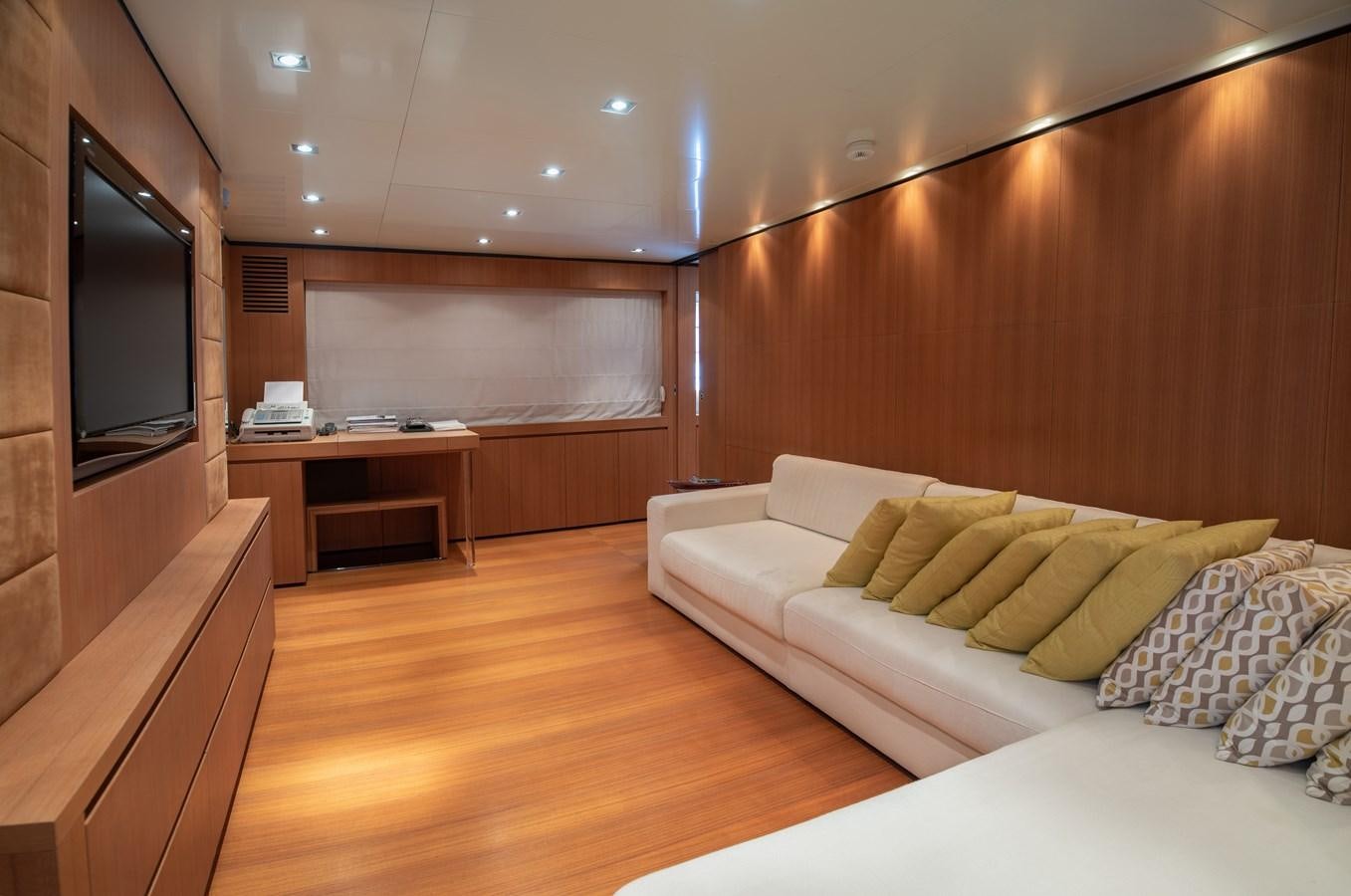 a room with a couch and a television aboard TIN TIN Yacht for Sale