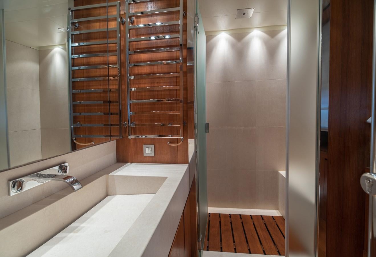 a bathroom with a tub and shower aboard TIN TIN Yacht for Sale