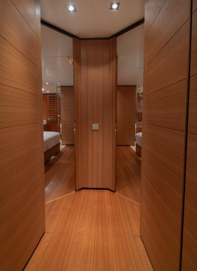 a room with wooden walls and a wood floor aboard TIN TIN Yacht for Sale