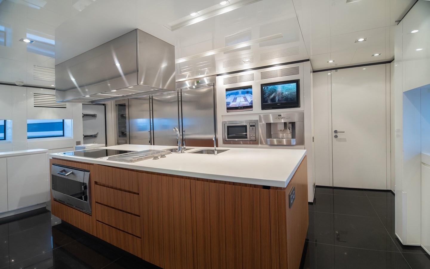 a kitchen with a large island aboard TIN TIN Yacht for Sale