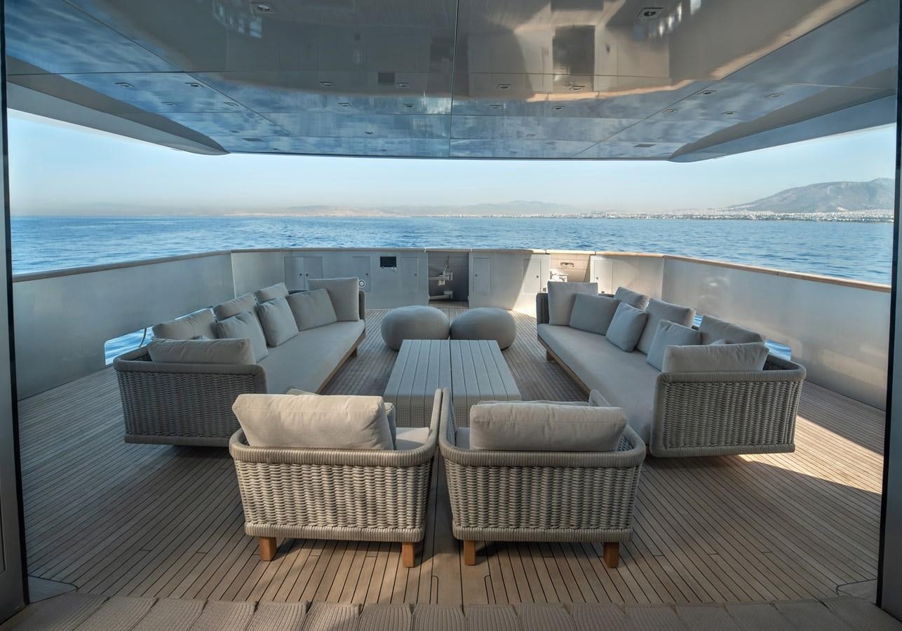 a room with a couch and a pool aboard TIN TIN Yacht for Sale