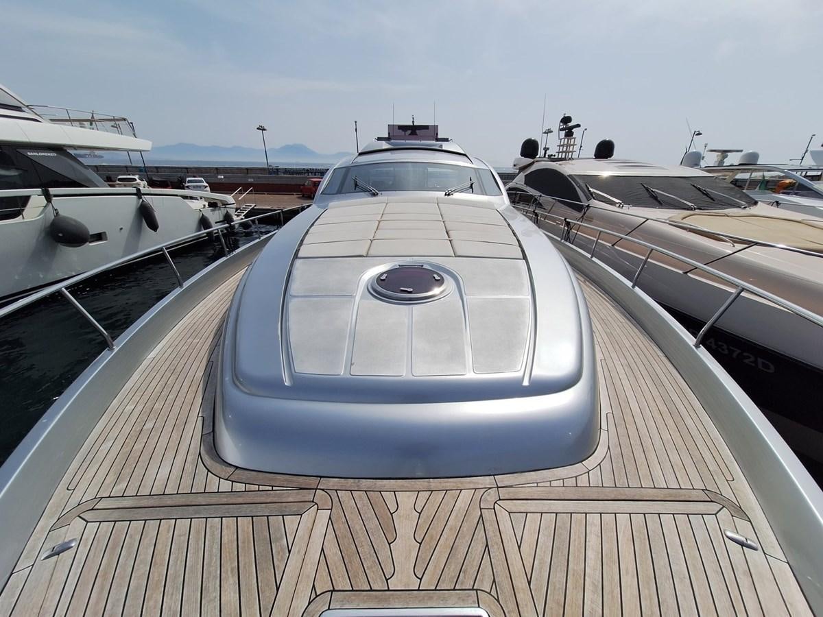 a large white pool with a deck and a deck with a view of the water and boats aboard MYLO Yacht for Sale