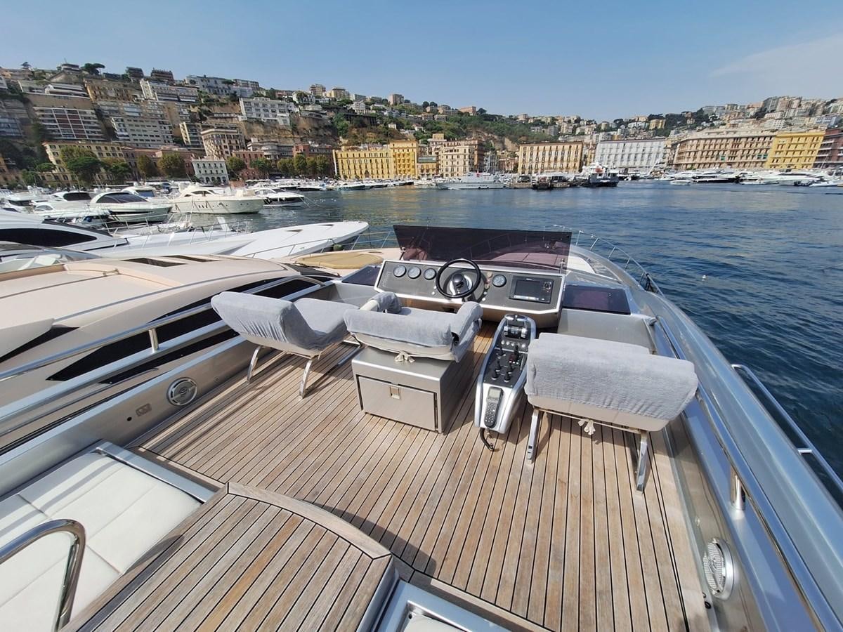 a deck with a boat and a dock with boats on it aboard MYLO Yacht for Sale