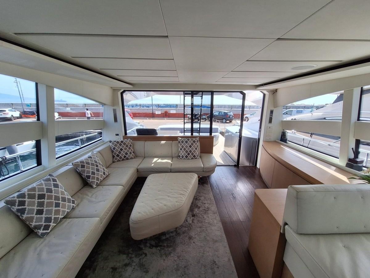 a living room with a large window aboard MYLO Yacht for Sale