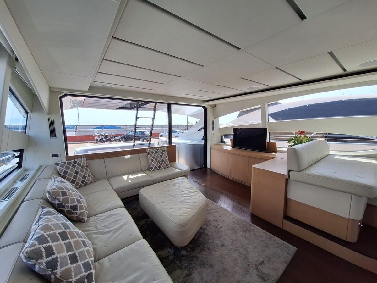 a living room with a large window aboard MYLO Yacht for Sale