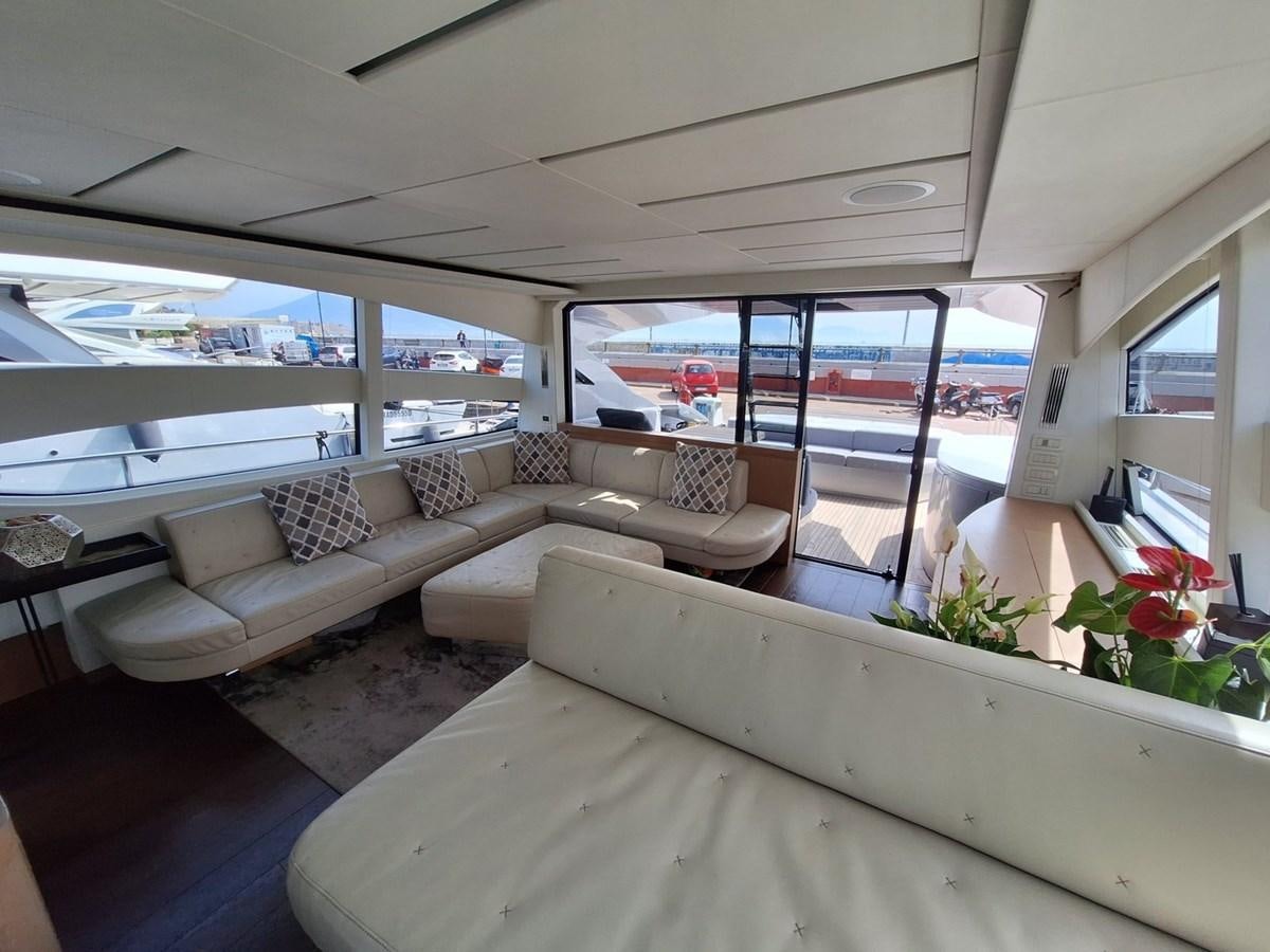 a living room with a large window aboard MYLO Yacht for Sale