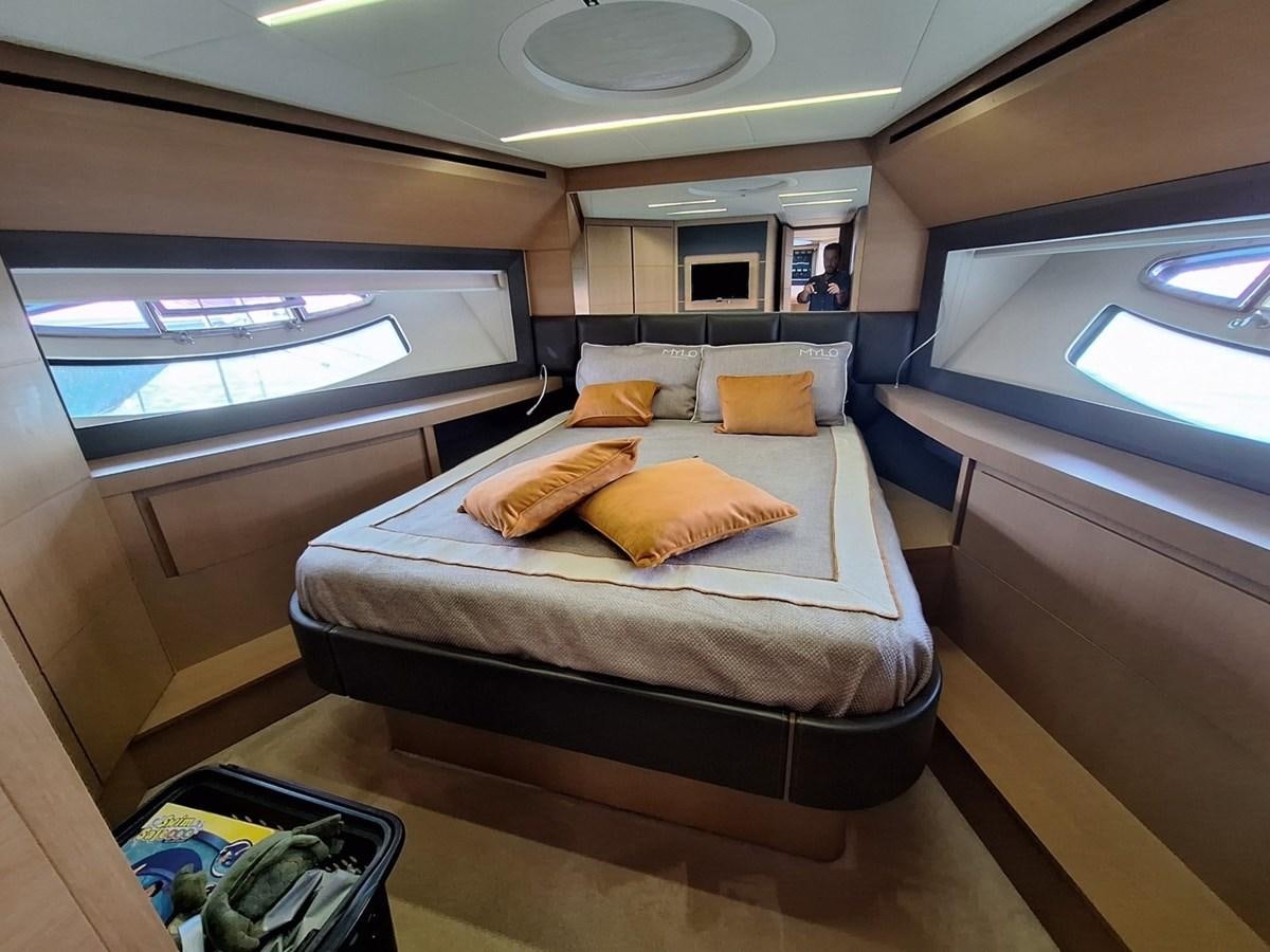 a bed in a room aboard MYLO Yacht for Sale