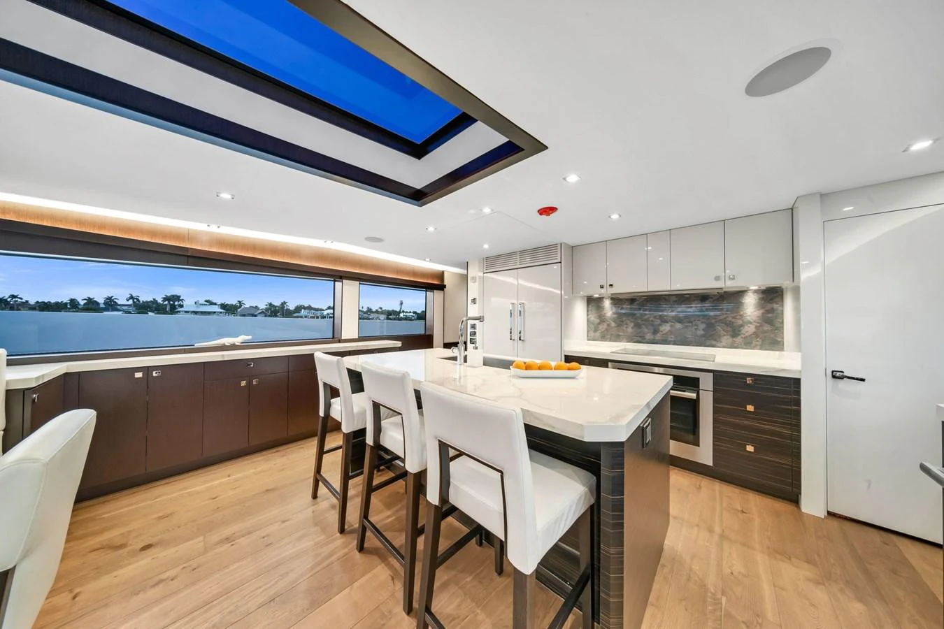 a kitchen with a table and chairs aboard ANOTHER IMPULSIVE DECISION Yacht for Sale