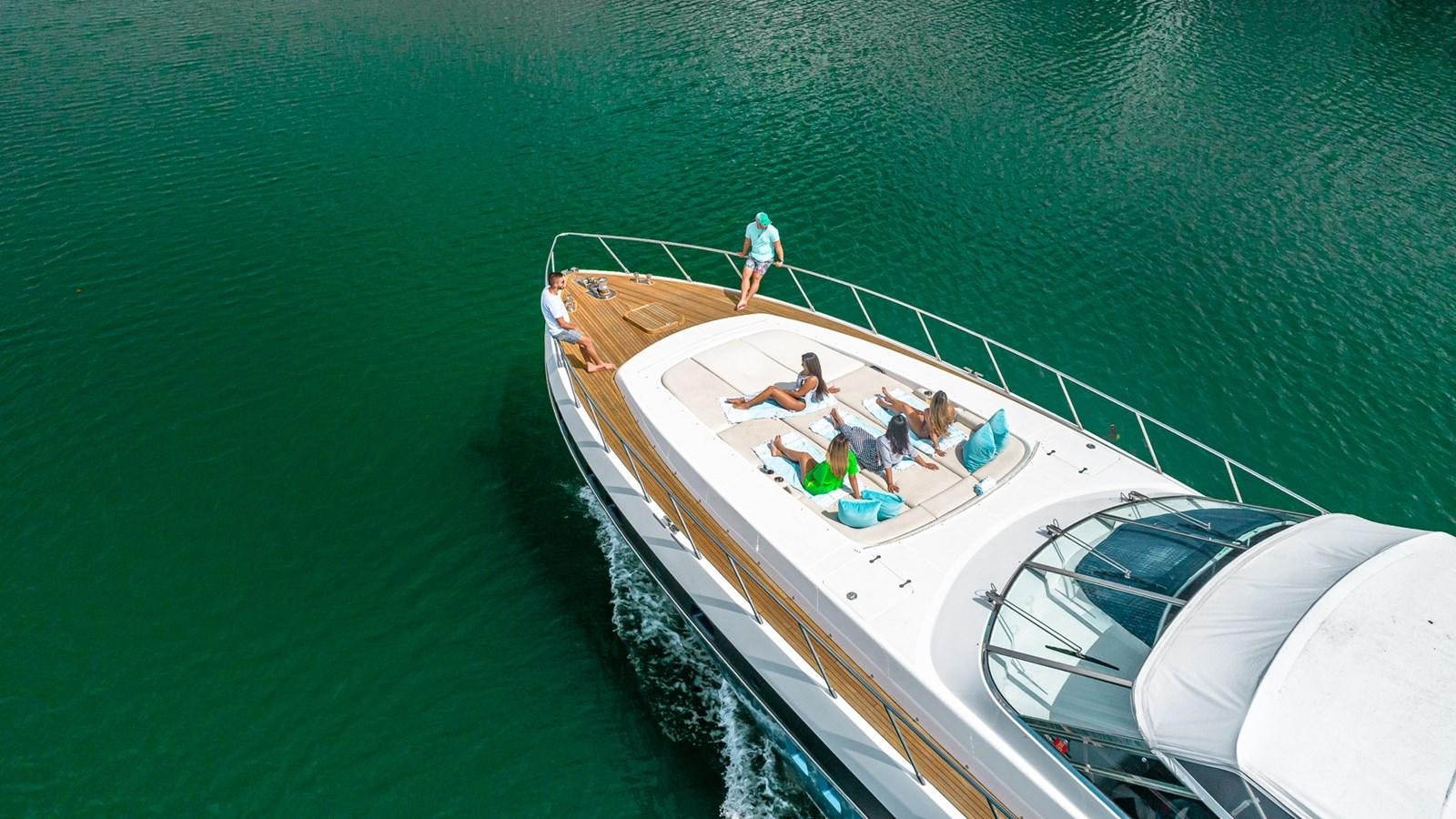 a group of people on a boat aboard HAPPY Yacht for Sale