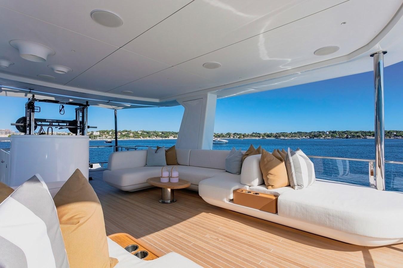 a large white couch in a room aboard ADELLA Yacht for Sale