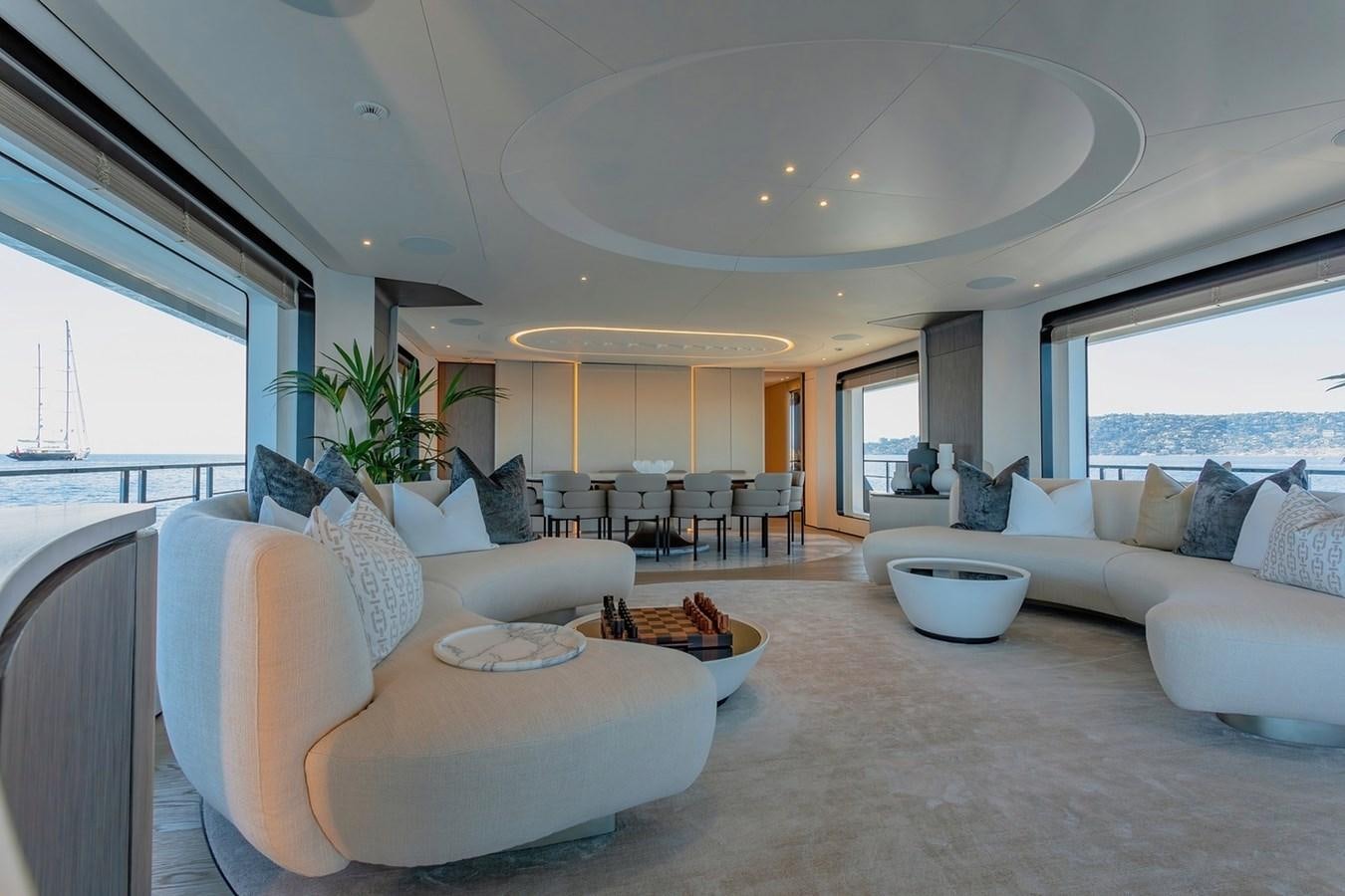 a living room with a couch and a table aboard ADELLA Yacht for Sale