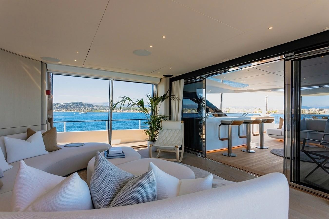 a living room with a large window aboard ADELLA Yacht for Sale
