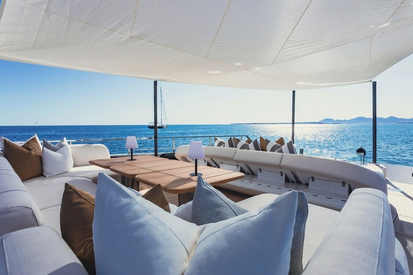 a large white bed with a white canopy over it aboard ADELLA Yacht for Sale