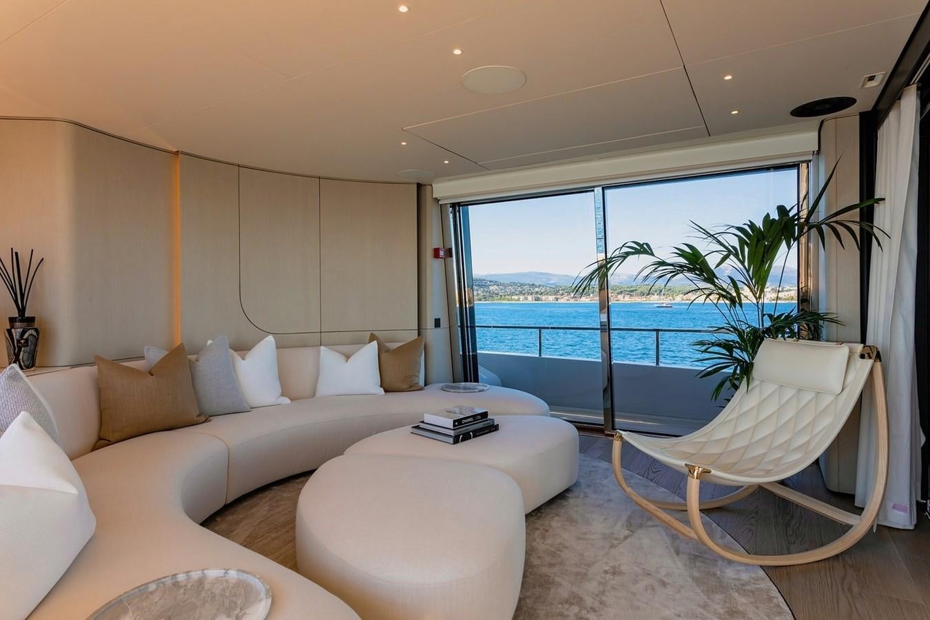 a room with a bed and a large window aboard ADELLA Yacht for Sale