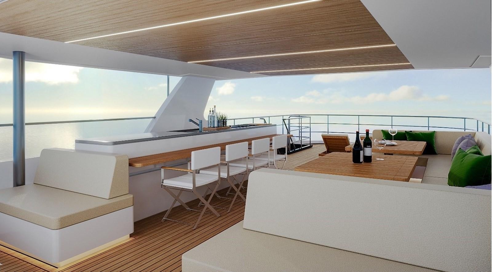 a room with a couch and a table and a view of the ocean aboard AVENTURA 130 Yacht for Sale