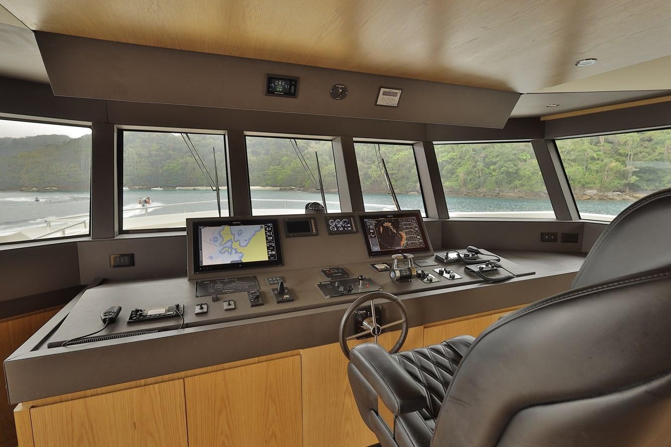 a room with a desk and computer aboard WAIKIKI Yacht for Sale