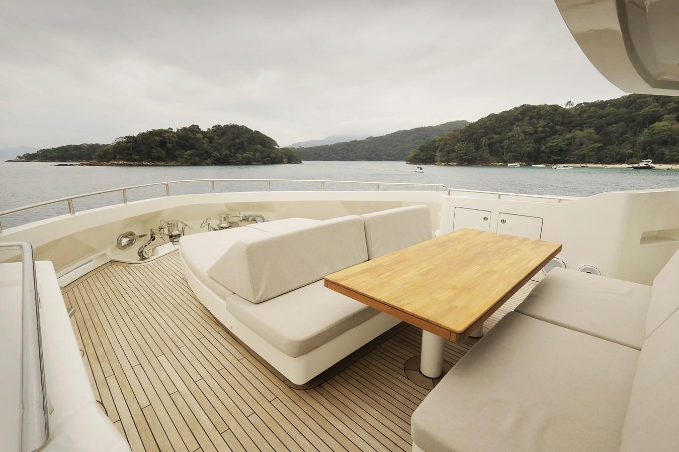 a room with a table and chairs aboard WAIKIKI Yacht for Sale