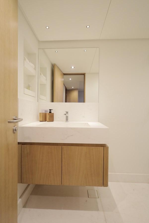 a bathroom with a large mirror aboard WAIKIKI Yacht for Sale
