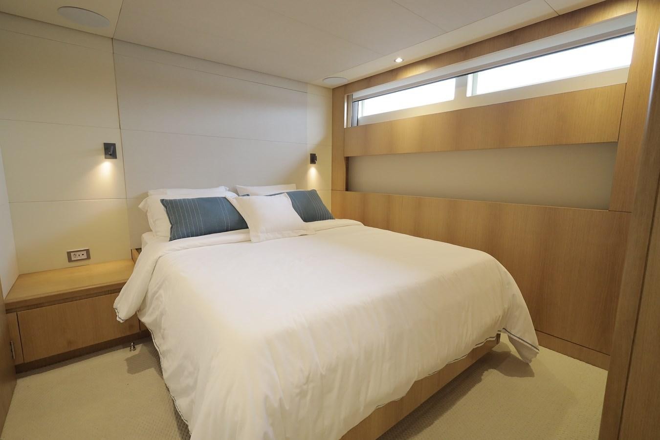 a couple of beds in a room aboard WAIKIKI Yacht for Sale