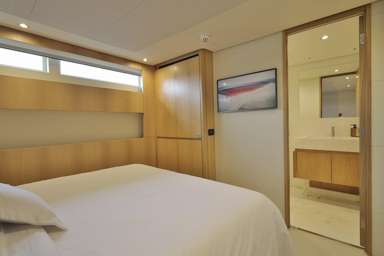 a bed in a room aboard WAIKIKI Yacht for Sale
