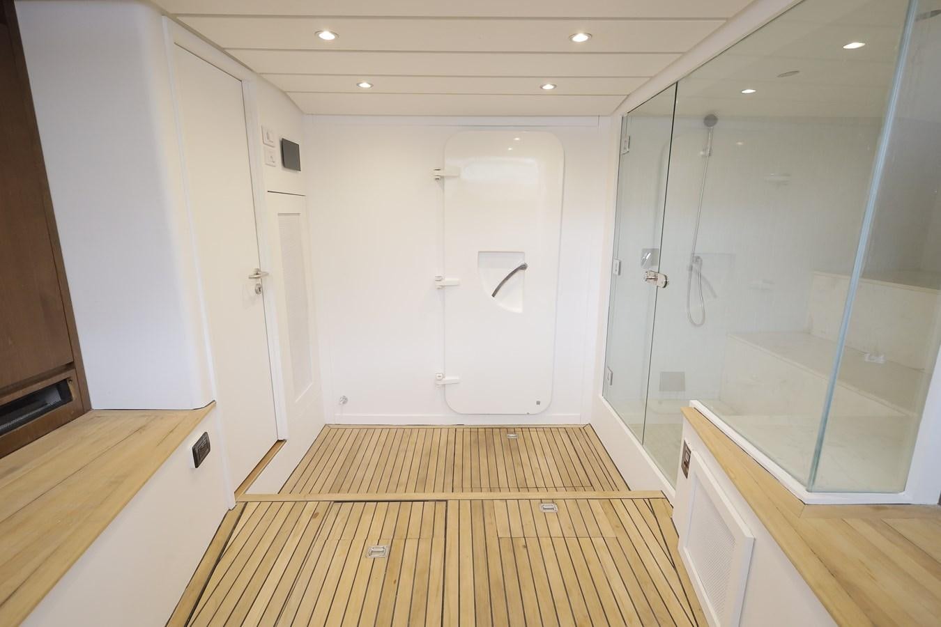 a room with white cabinets aboard WAIKIKI Yacht for Sale