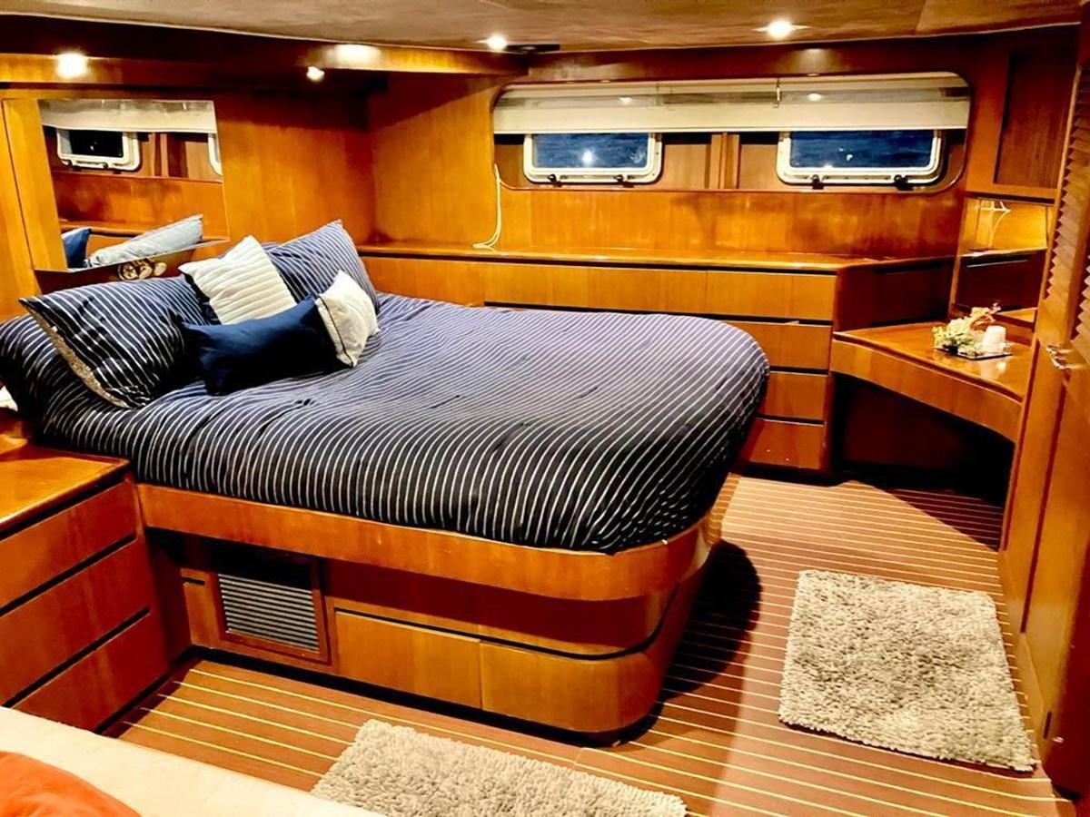 a bed in a room aboard A NEW BEGINNING Yacht for Sale
