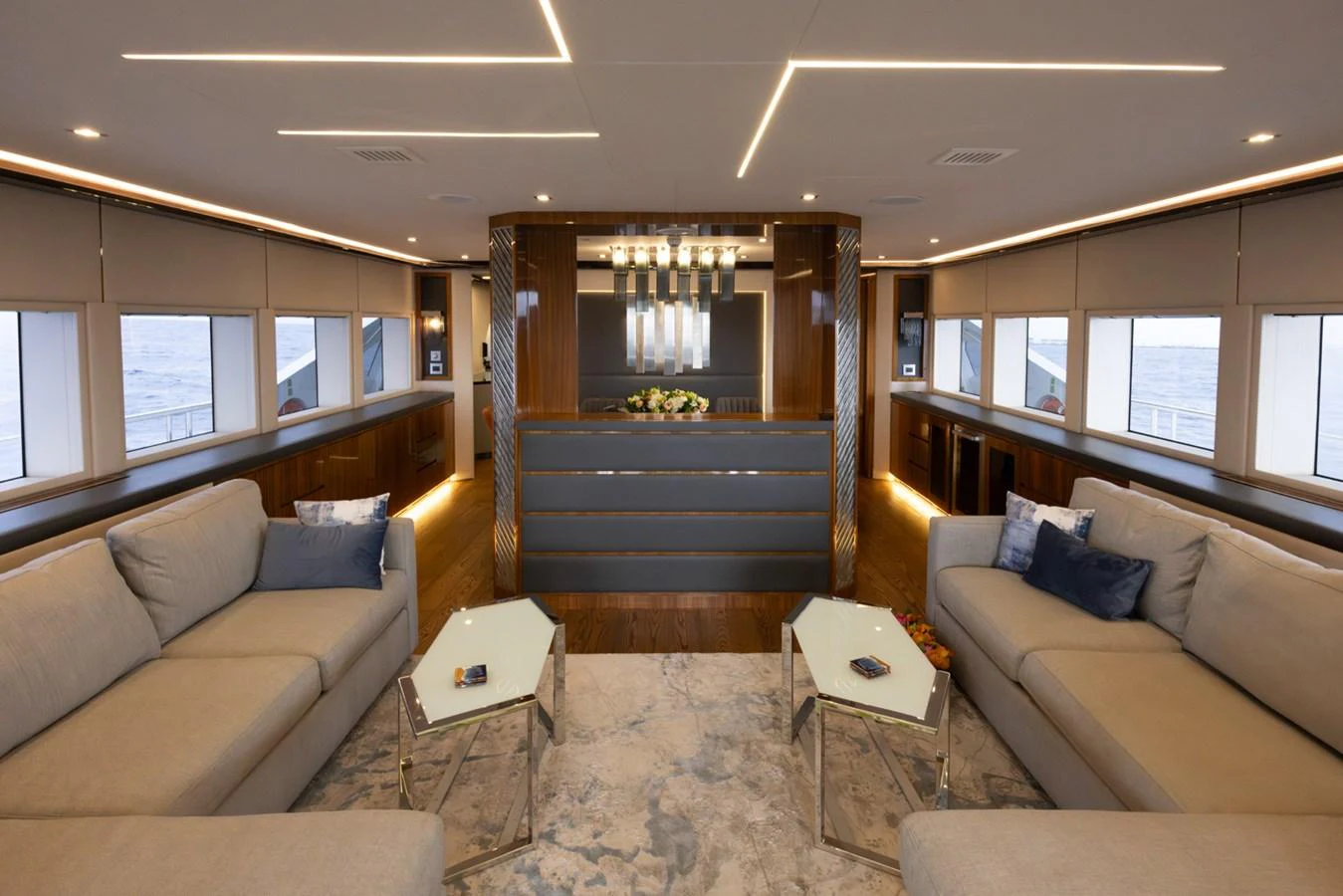 a living room with a staircase aboard KANDO Yacht for Sale
