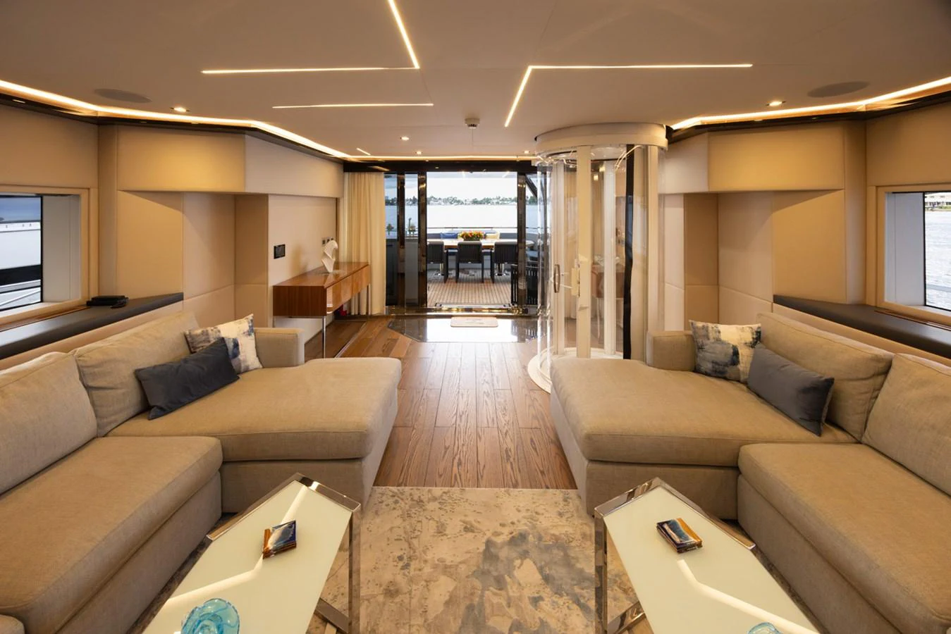 a living room with a couch and a table aboard KANDO Yacht for Sale