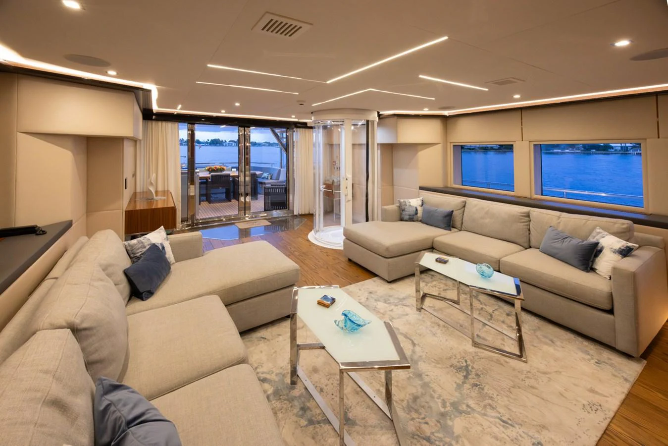 a living room with a large window aboard KANDO Yacht for Sale