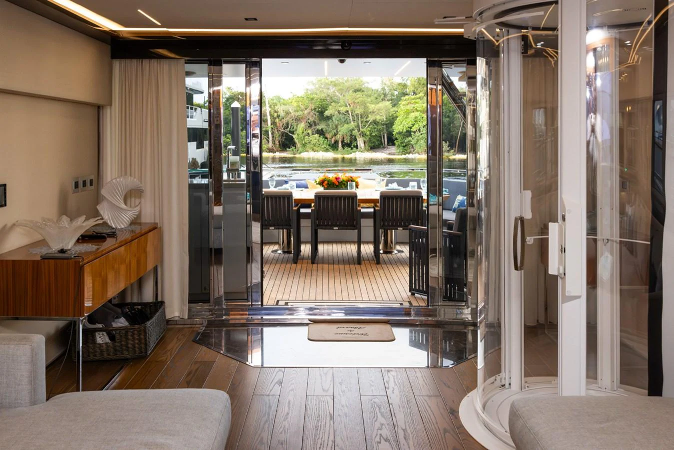 a room with a table and chairs aboard KANDO Yacht for Sale