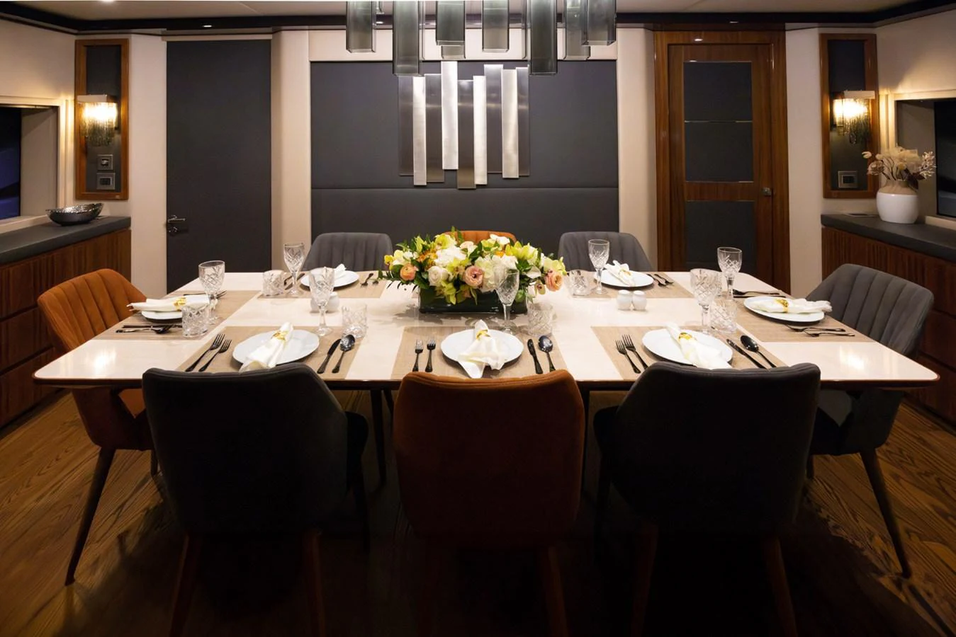 a dining table set for a dinner aboard KANDO Yacht for Sale