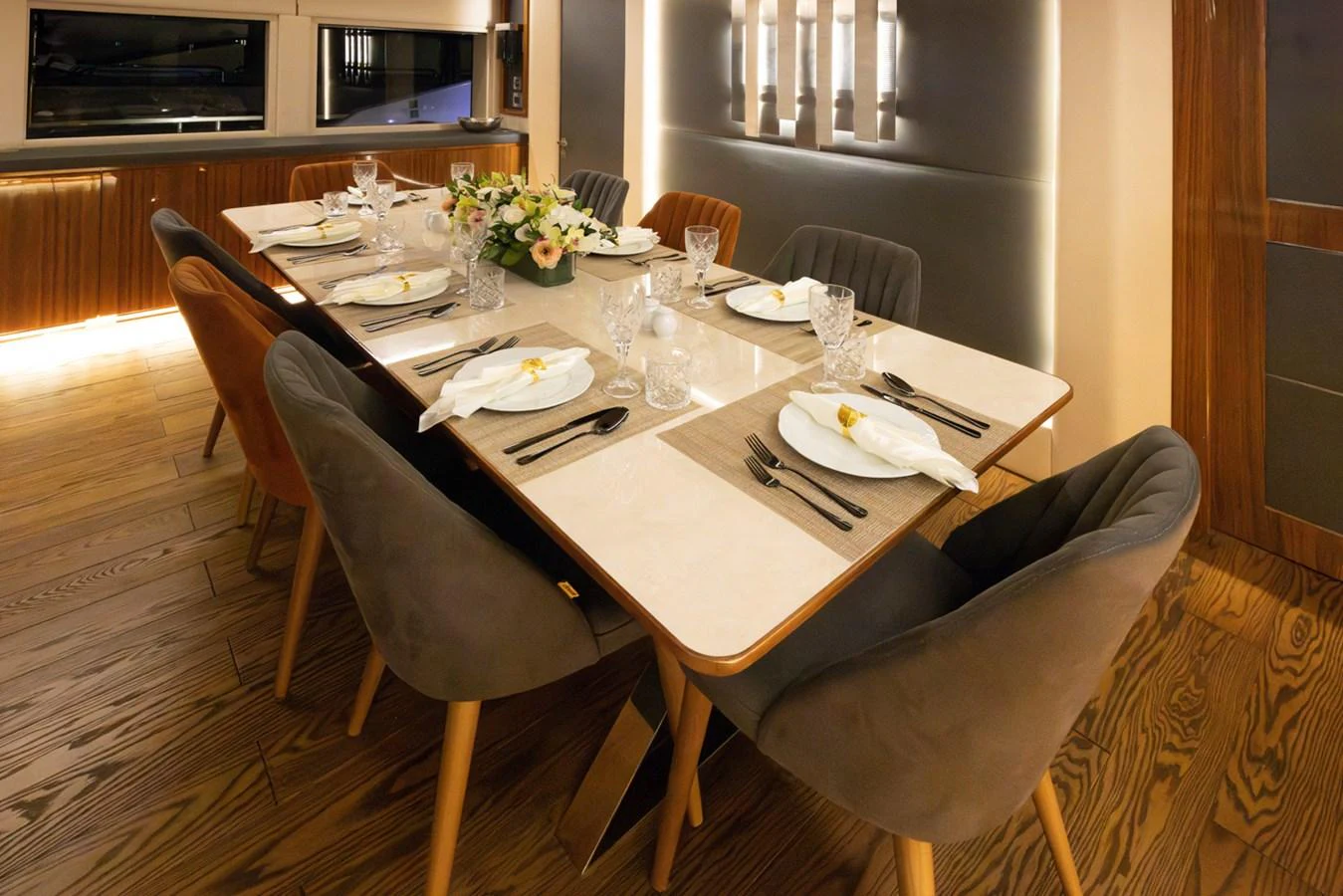 a table with plates and silverware aboard KANDO Yacht for Sale