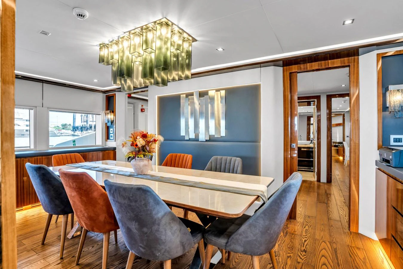 a dining room with a table and chairs aboard KANDO Yacht for Sale
