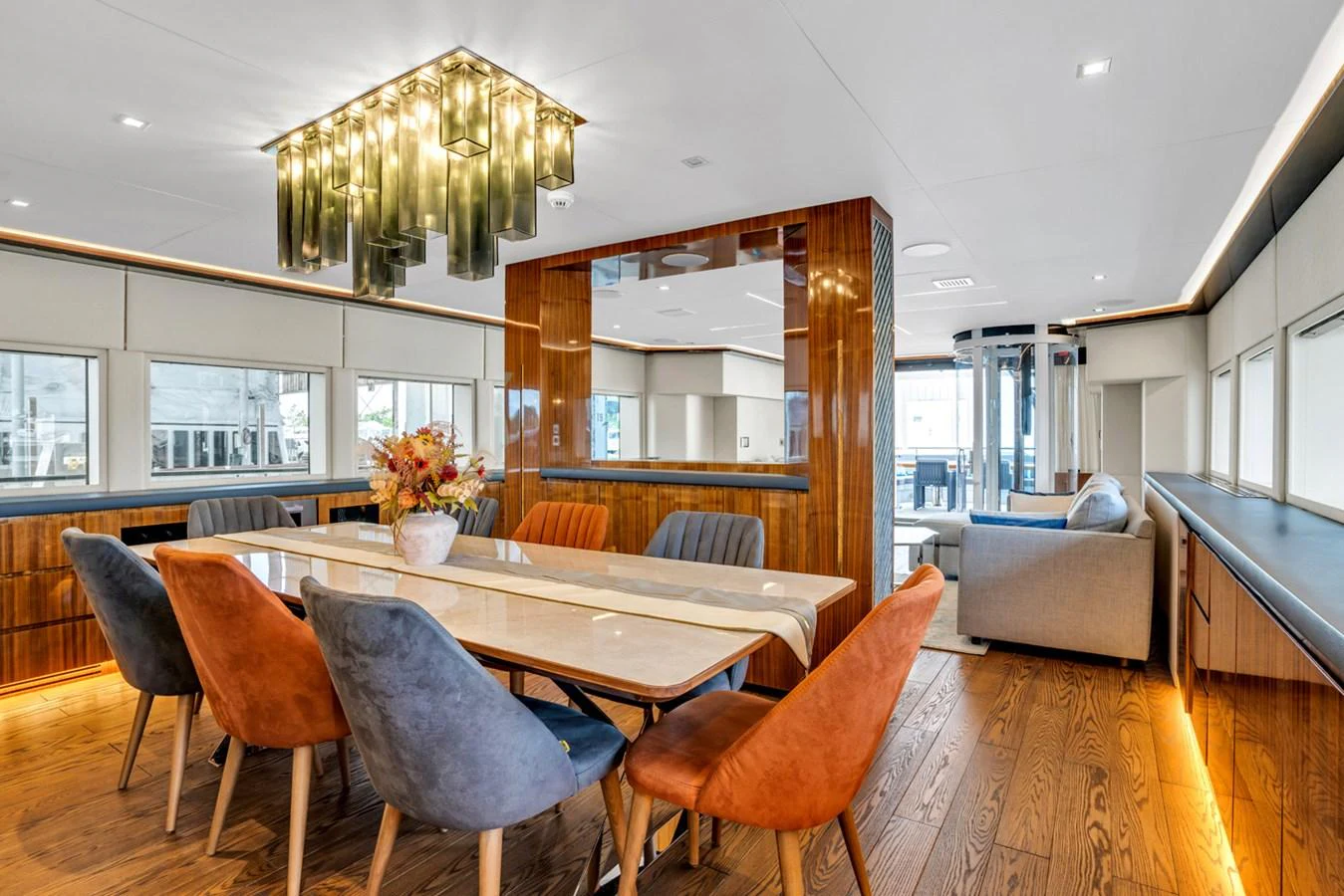 a dining room with a table and chairs aboard KANDO Yacht for Sale