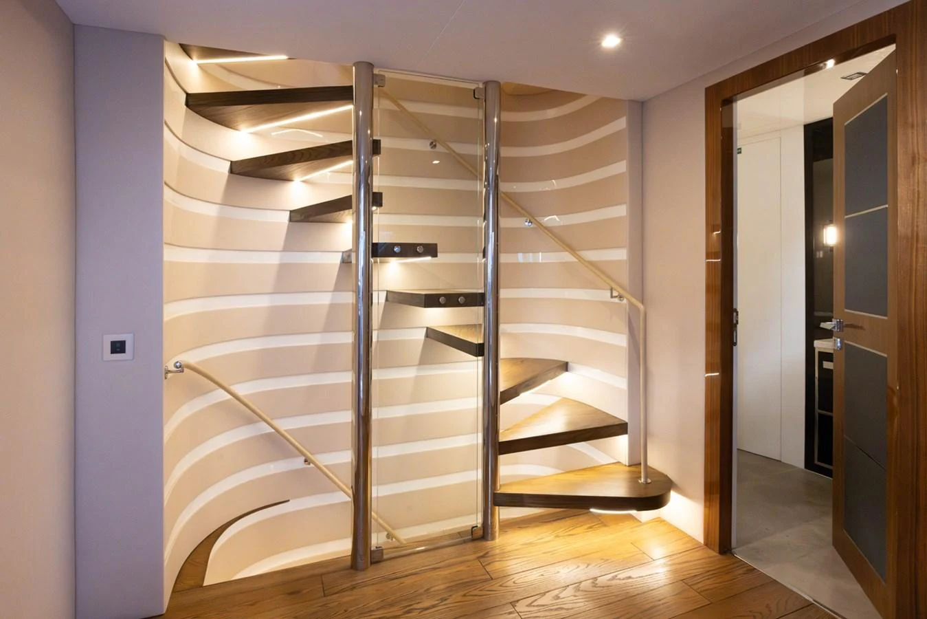 a metal staircase in a room aboard KANDO Yacht for Sale