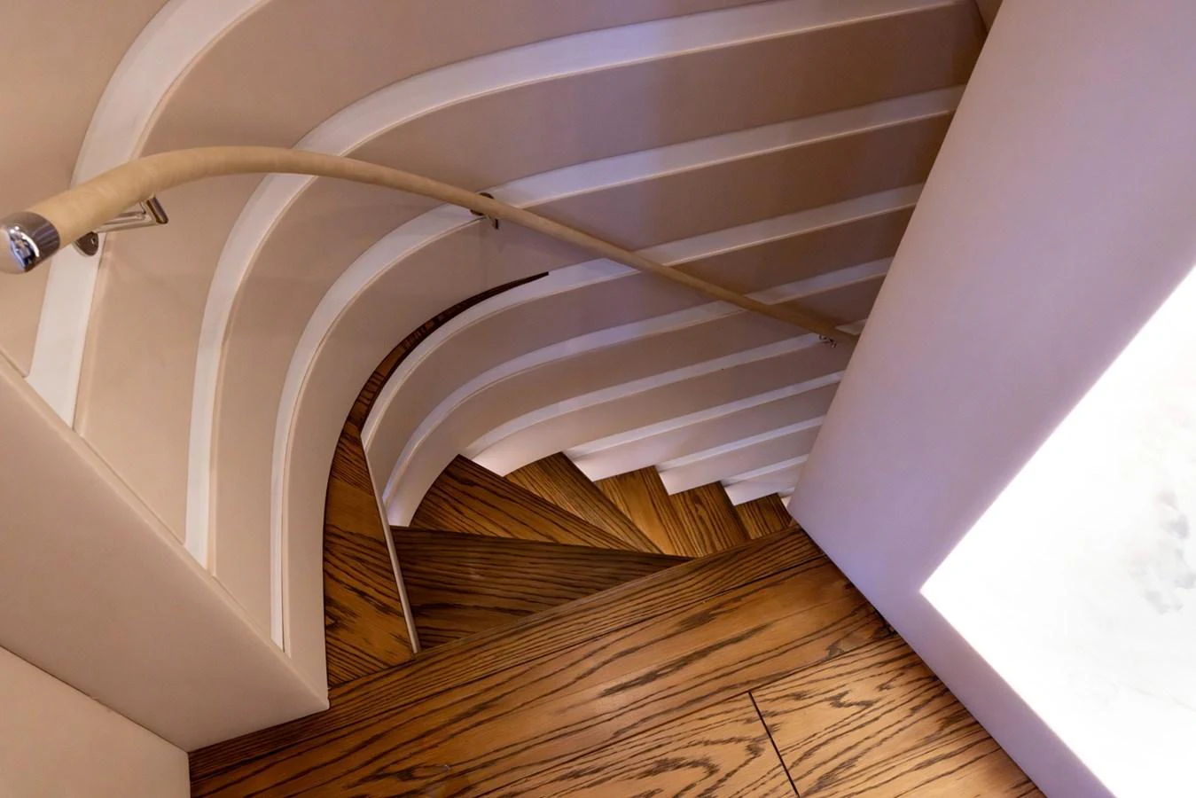 a white staircase with a railing aboard KANDO Yacht for Sale
