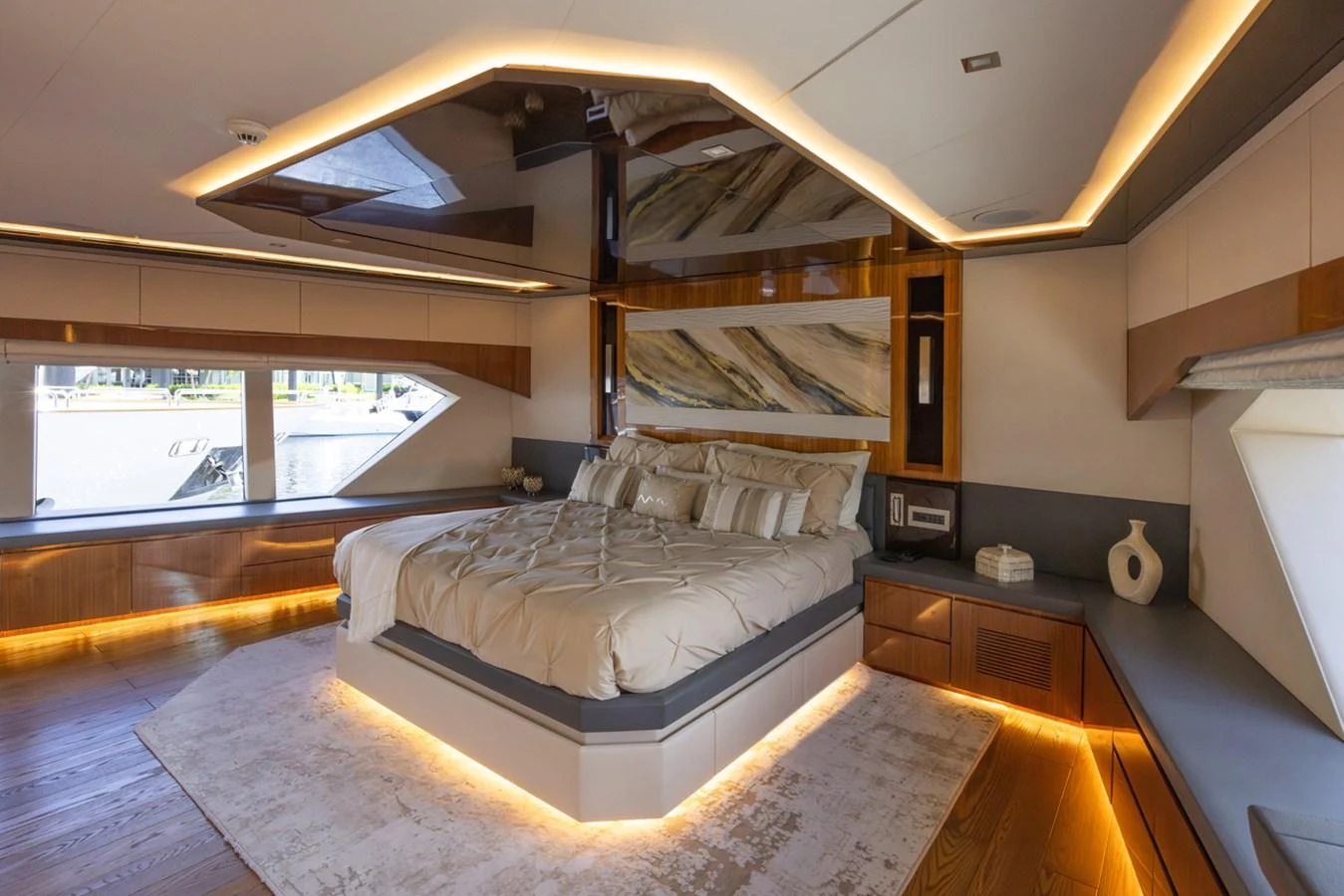 a bedroom with a large bed aboard KANDO Yacht for Sale