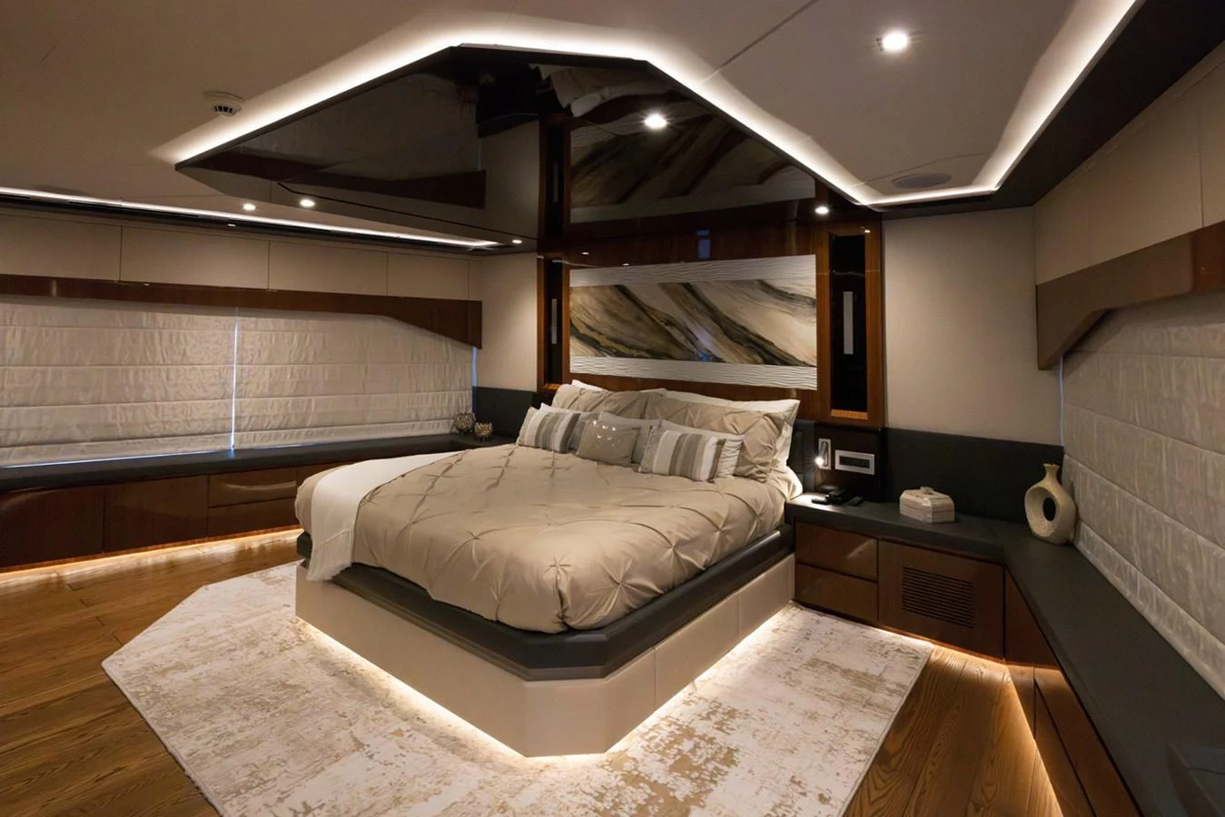 a room with a bed and a wall of windows aboard KANDO Yacht for Sale