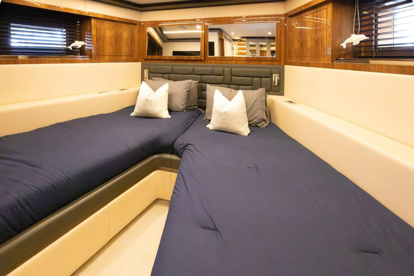 a bed with pillows aboard KANDO Yacht for Sale