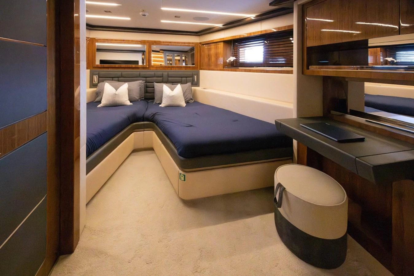 a bed in a room aboard KANDO Yacht for Sale