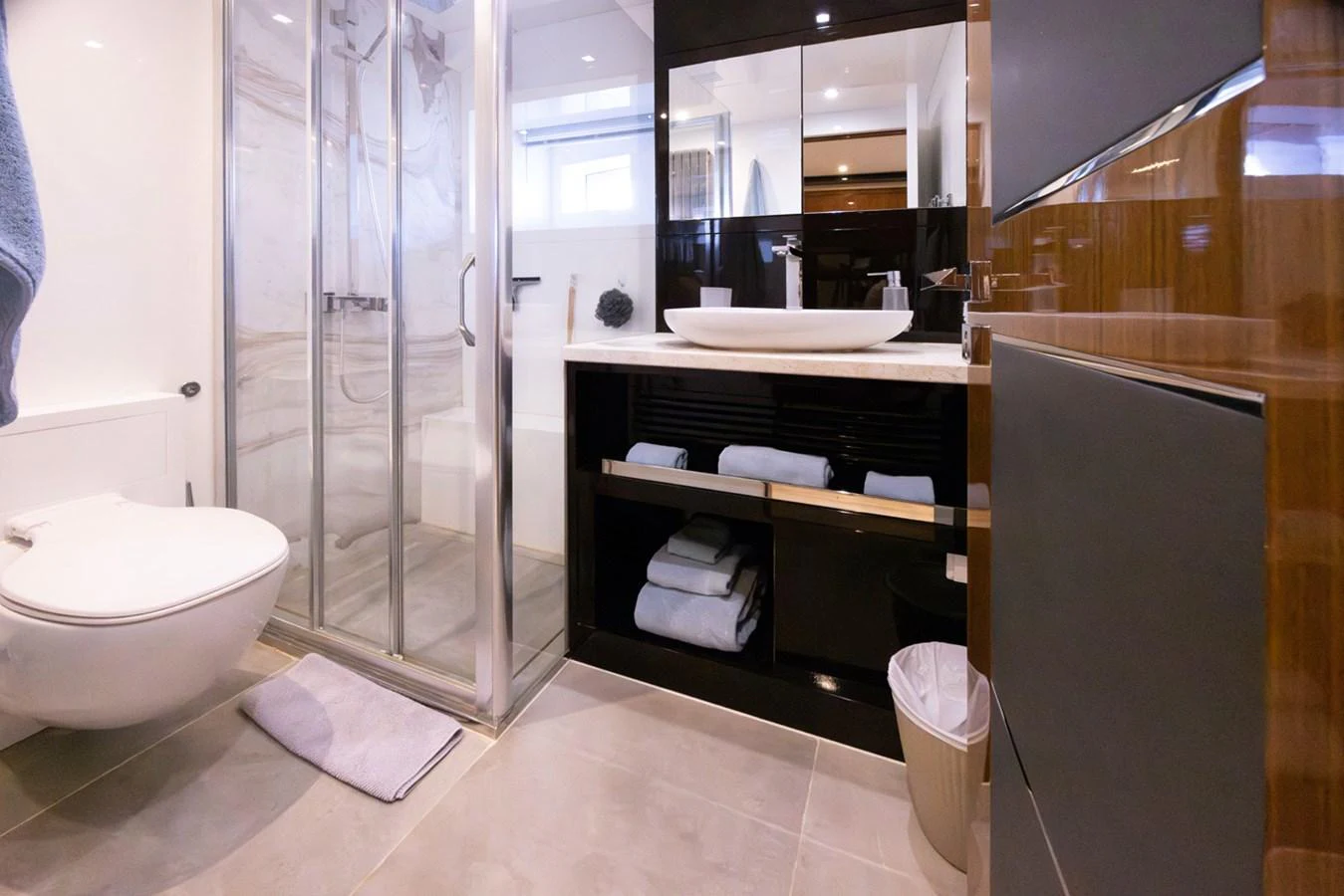 a bathroom with a stand up shower aboard KANDO Yacht for Sale