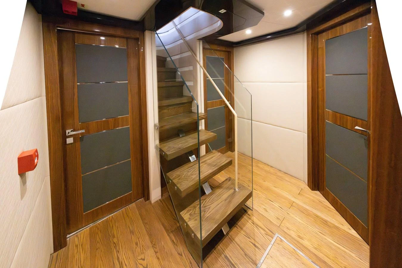a wooden staircase in a room aboard KANDO Yacht for Sale