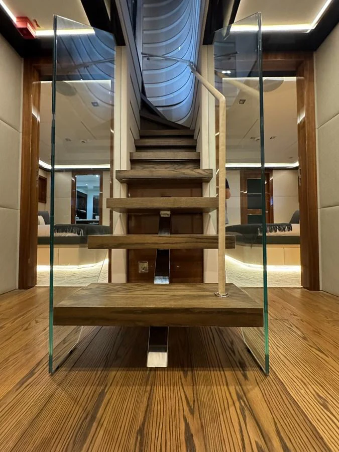 a set of stairs in a room aboard KANDO Yacht for Sale