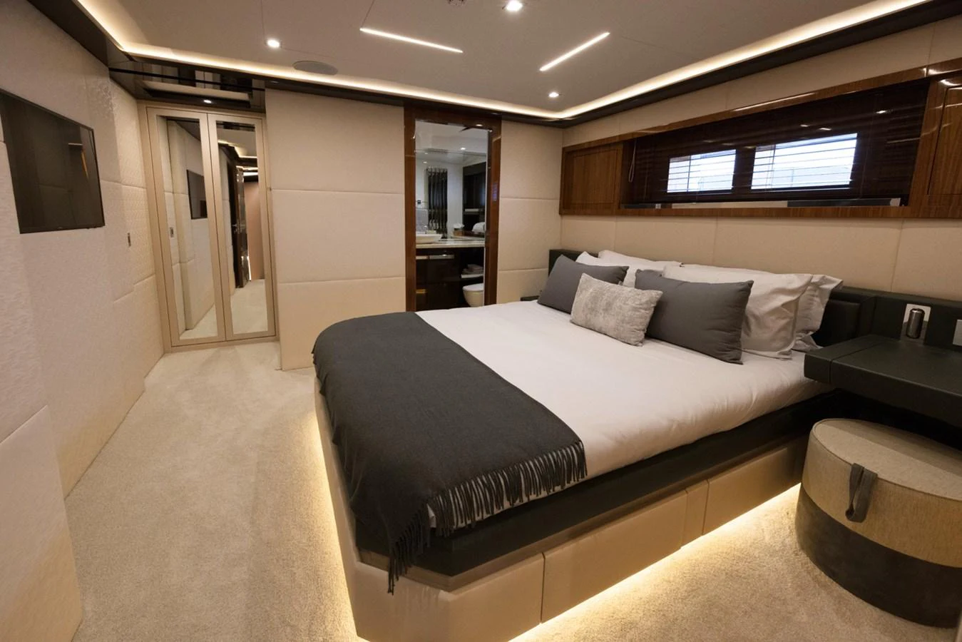 a large bed in a room aboard KANDO Yacht for Sale