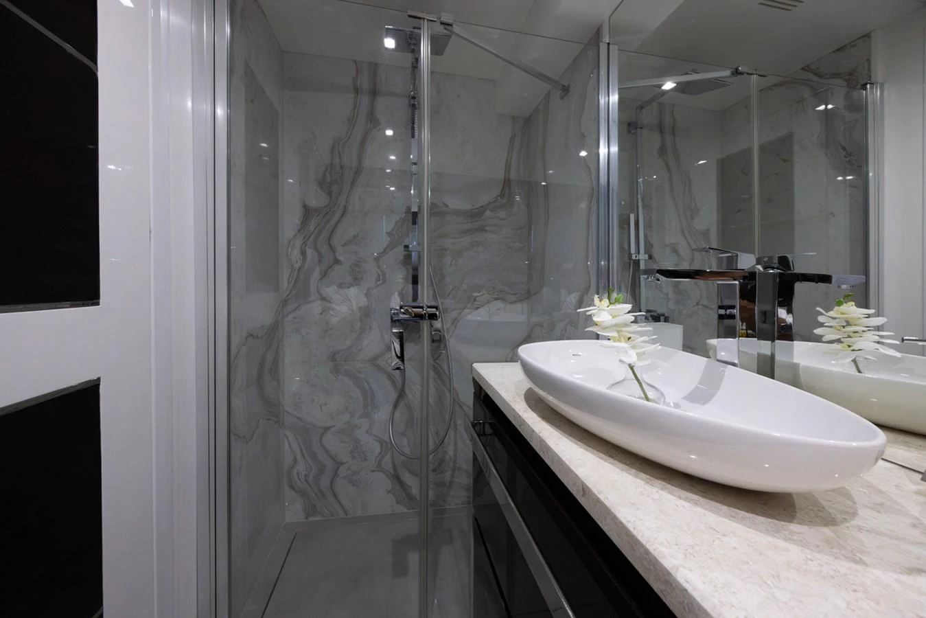 a bathroom with a shower and sink aboard KANDO Yacht for Sale